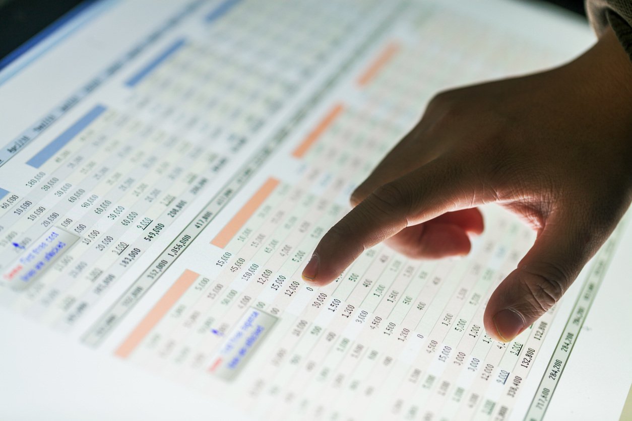 Person scrolling a Microsoft Excel spreadsheet on a touchscreen